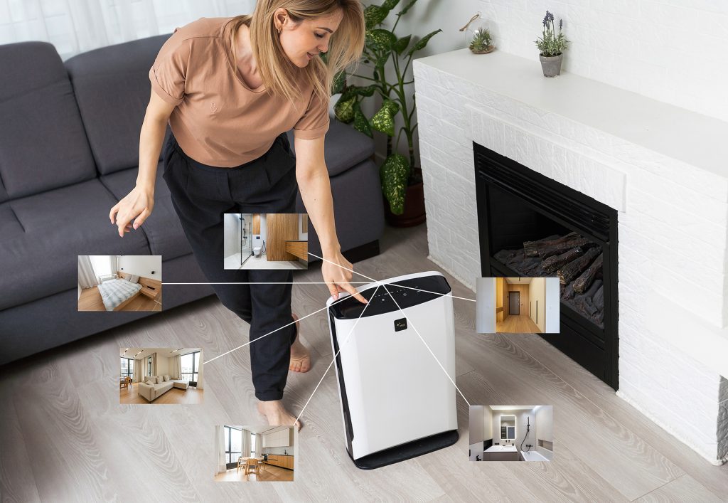 Modern air purifier cleans up the air in the living room with graphic program