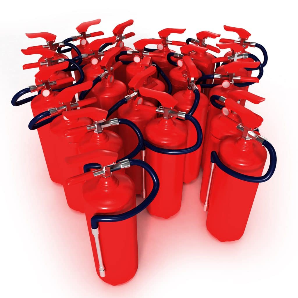Group of red fire extinguishers on a white background