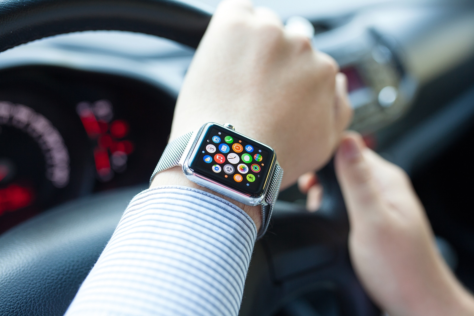 Man Hand In The Car With Apple Watch And Icon