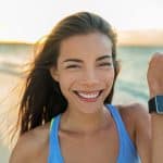 Smartwatch happy girl showing display screen on trendy new smart