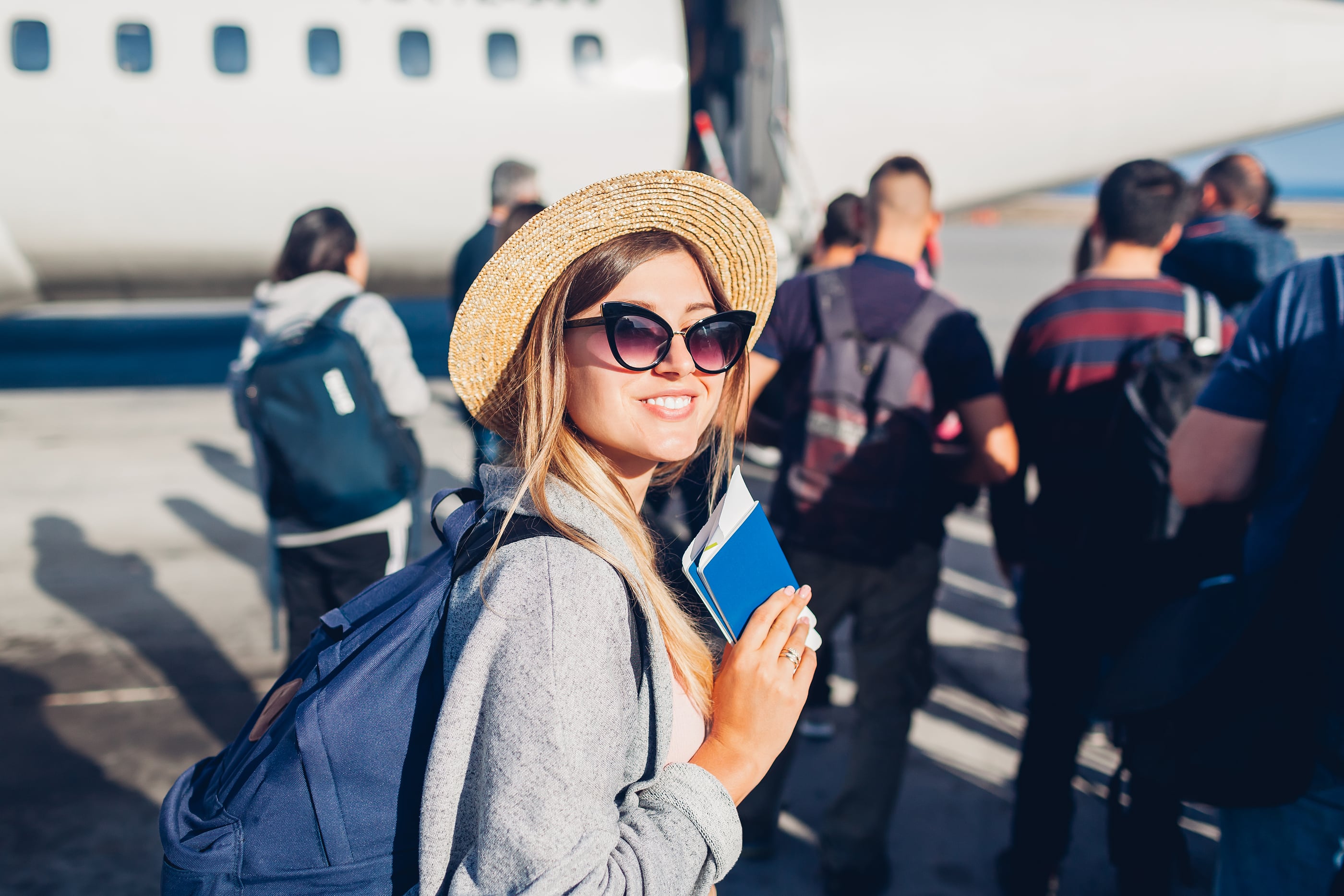 Woman Traveler Boarding On Plane Holding Passport Happy Passeng