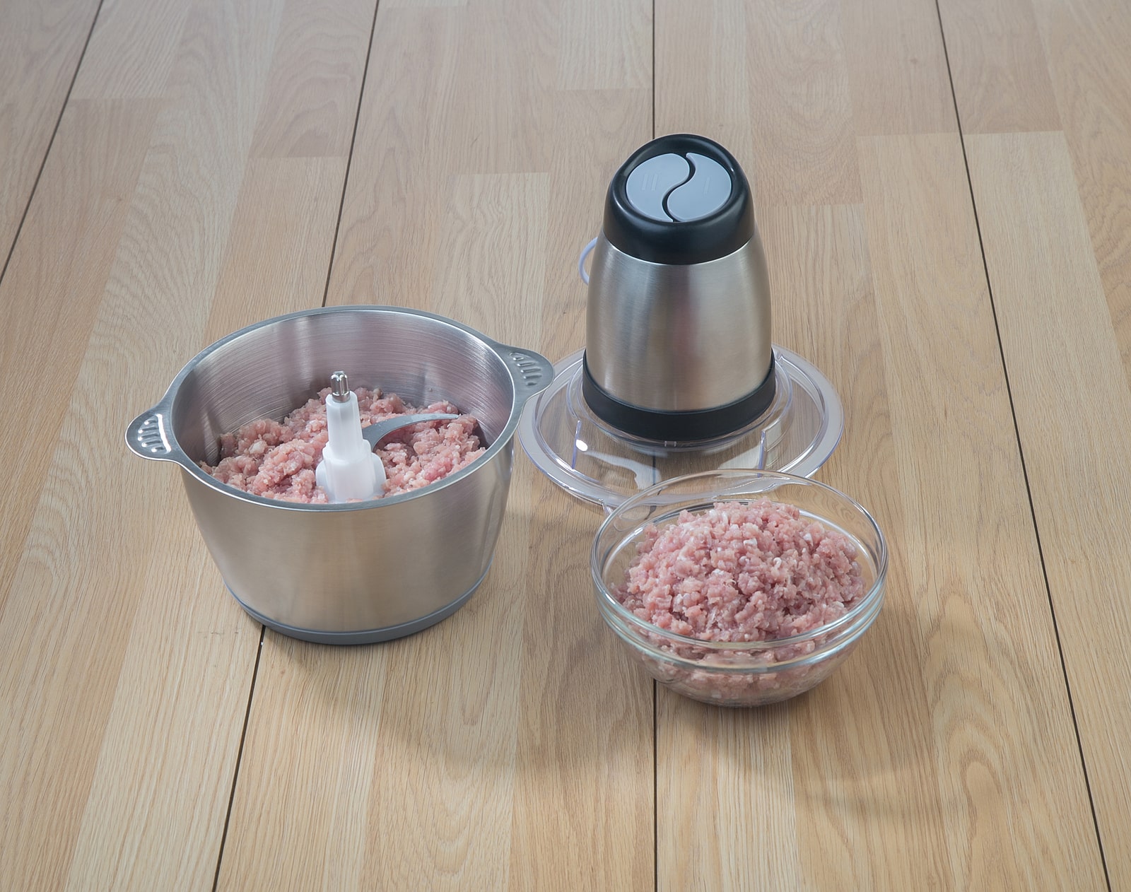Food Processor With Mince Pork On Wooden Table Background