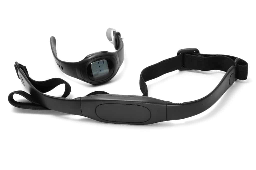 watch and chest strap of a heart rate monitor on a white background