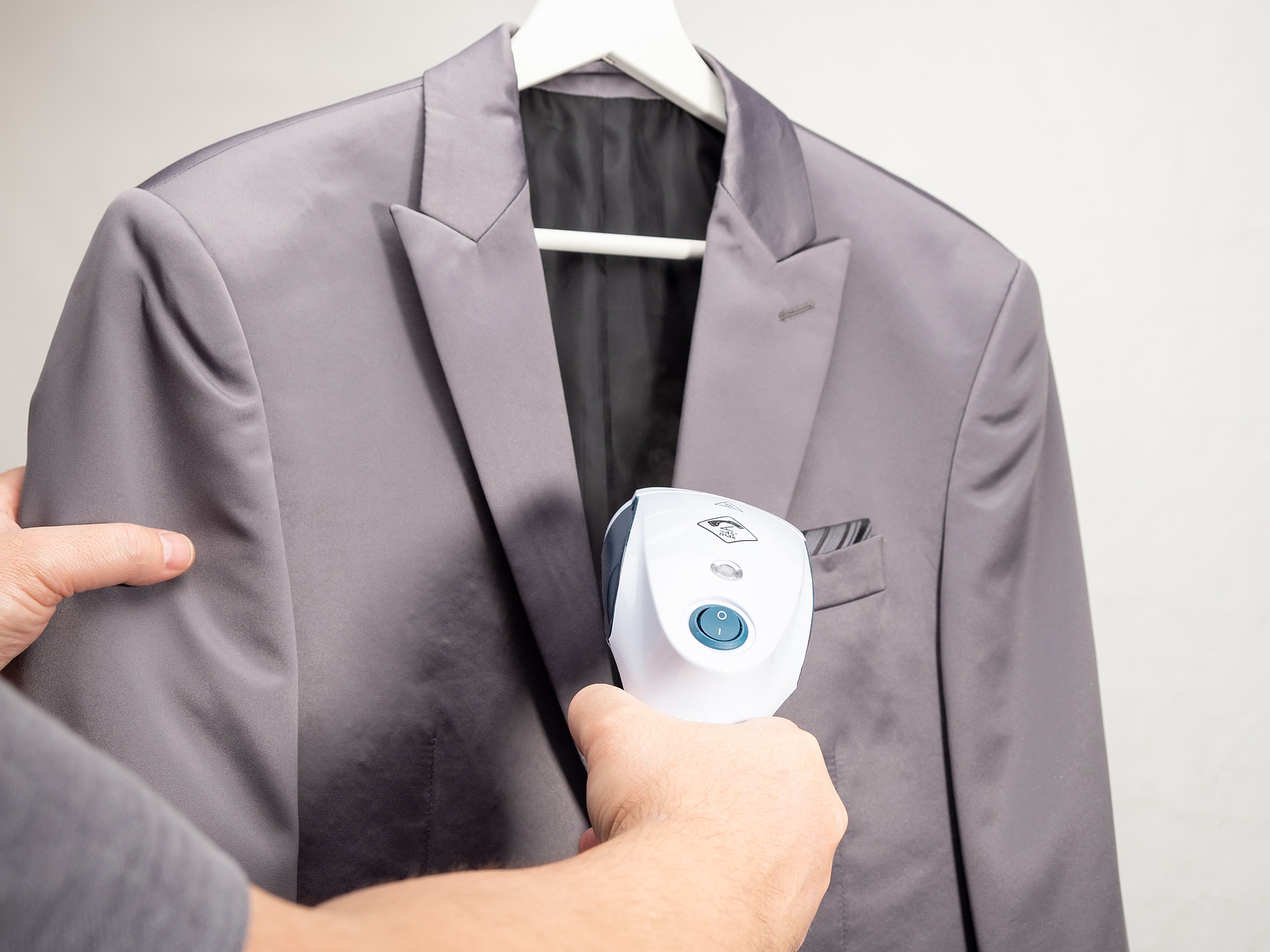 In Hand Steamer For Clothes The Suit Is Ironed With A Portable