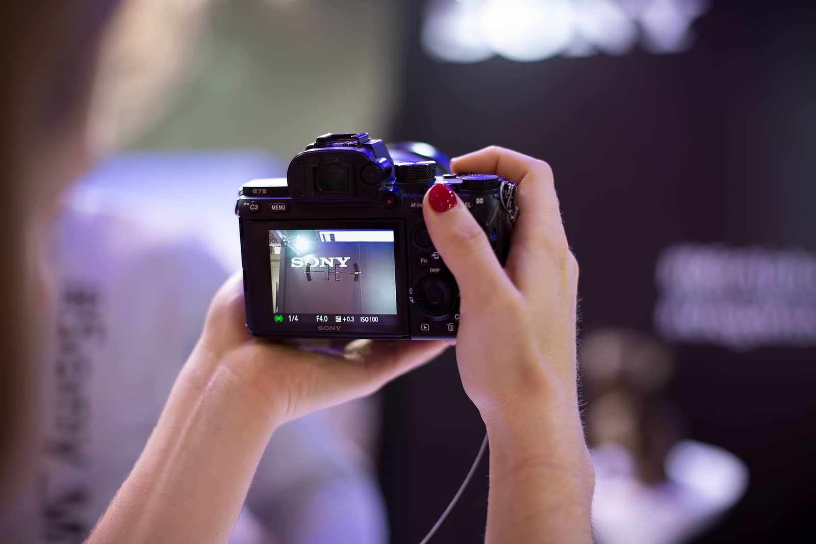  sony alpha a7 iii 3 in womans hands pointing 