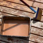 Overhead View Of Stain Material On Outdoor Home Cedar Wood Deck - Savvy Home Guide Overhead view of stain material on outdoor home cedar wood deck