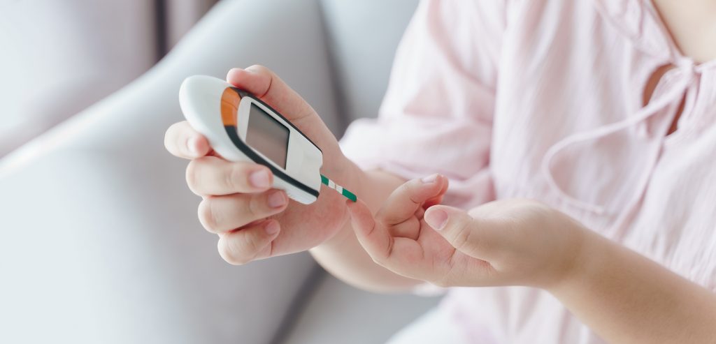 checking blood sugar level by Digital Glucose meter