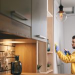 cleaning the house wearing gloves